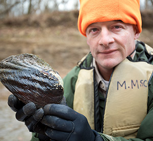 biologist with mussel